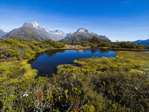 Small lake and mountains in Fiordland National Park, Te Anau, Fiordland, New Zealand