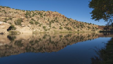 Usa, New Mexico, Abiquiu, Rio Chama, Hills reflected in Chama River, Abiquiu, New Mexico, USA