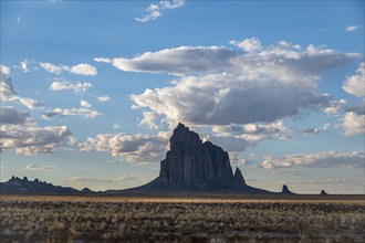 Usa, New Mexico, Shiprock, Clouds over desert landscape with Shiprock, Shiprock, New Mexico, USA