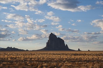 Usa, New Mexico, Shiprock, Clouds over desert landscape with Shiprock, Shiprock, New Mexico, USA