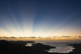 USA, United States Virgin Islands, St. John, Sunbeams over Caribbean Sea at sunset, St. John,