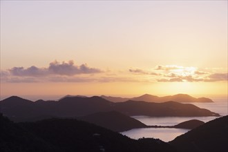 USA, United States Virgin Islands, St. John, Golden sunrise over calm Caribbean Sea, St. John,