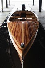 Wooden motorboat at pier, , New York, USA