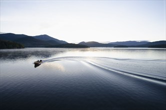 Boating at dawn on Lake Placid Lake, North Elba, New York, USA, Lake Placid, New York, USA