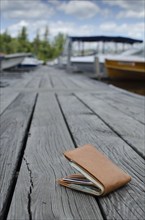 Lost wallet on boat dock, Lake Placid, New York, USA