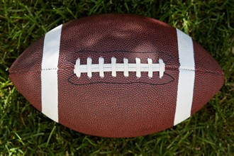 Overhead view of American football ball on field, New York, New York, USA