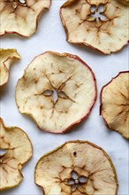 Close-up of baked apple slices on white background, New York, New York, USA