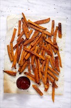 Overhead view of sweet potato fries and small bowl of ketchup, New York, New York, USA