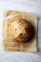 Overhead view of sourdough bread on parchment paper, New York, New York, USA