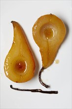 Overhead view of slices of baked pears with vanilla bean, New York, New York, USA