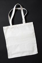 White tote bag against black background, New York, New York, USA