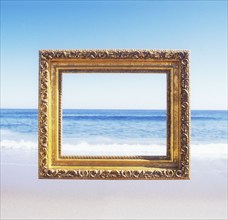 USA, New Jersey, Spring Lake, Golden ornate picture frame against beach and sea, Spring Lake, New