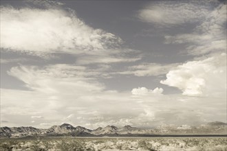 USA, California, Amboy, Clouds above barren hills in Mojave Desert, Amboy, California, USA