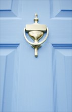 USA, New Jersey, Mendham, Close-up of blue front door with brass door knocker, Mendham, New Jersey,