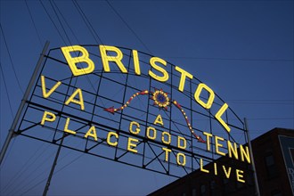 USA, Virginia, Bristol, Low angle view of Bristol sign over State Street against sky at dusk,