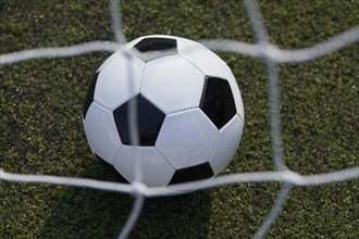 USA, New York State, New York City, Close-up of soccer ball on turf field, New York City, New York,