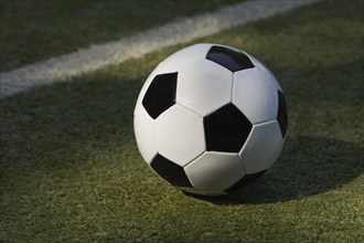 USA, New York State, New York City, Soccer ball on turf field, New York City, New York, USA