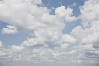 White cumulus clouds against blue sky, Savannah, Georgia, USA