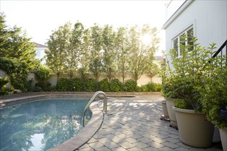 USA, New York, Long Beach, Swimming pool and trees in backyard, New York City, New York, USA