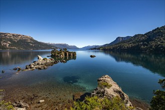 Calm Traful Lake and rock formations on Estancia Arroyo Verde, Estancia Arroyo Verde, Nequen