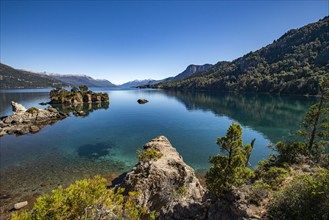 Calm Traful Lake and rock formations on Estancia Arroyo Verde, Estancia Arroyo Verde, Nequen