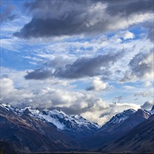 Argentina, Santa Cruz, El Chalten, Clouds above snowcapped peaks surrounding El Chalten, El