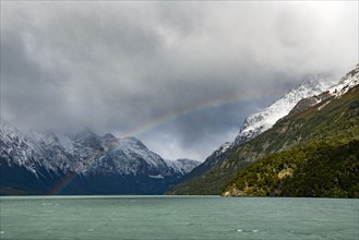 Argentina, Santa Cruz, El Calafate, Rainbow and clouds over lake at Perito Moreno Glacier, El