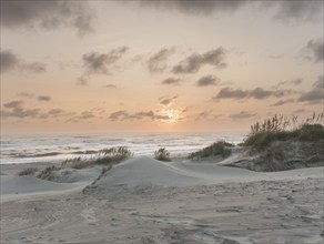 USA, North Carolina, Nags Head, Sunrise above sandy beach and sea, Nags Head, North Carolina, USA