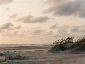 USA, North Carolina, Nags Head, Sunrise above sandy beach and sea, Nags Head, North Carolina, USA