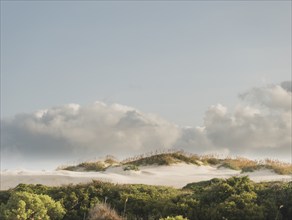 USA, North Carolina, Nags Head, Clouds over sand dunes, Nags Head, North Carolina, USA