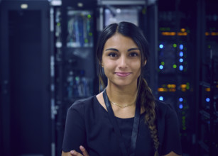 Portrait of smiling female technician in server room 
St, George, Utah, USA