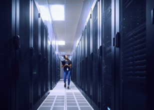 Female technician walking in server room
St, George, Utah, USA