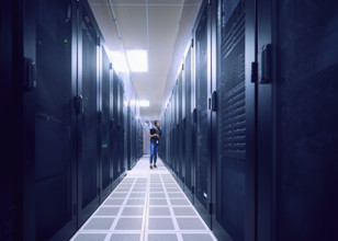 Female technician walking in server room
St, George, Utah, USA