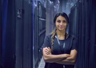 Portrait of smiling female technician in server room 
St, George, Utah, USA