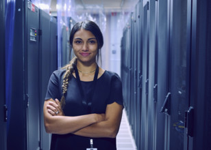 Portrait of smiling female technician in server room 
St, George, Utah, USA