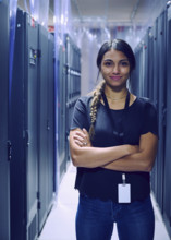 Portrait of smiling female technician in server room 
St, George, Utah, USA