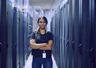 Portrait of smiling female technician in server room 
St, George, Utah, USA