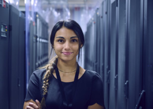 Portrait of smiling female technician in server room 
St, George, Utah, USA