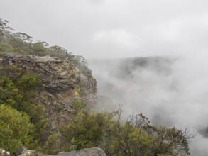 Hiker standing on observation point on top of mountain covered with clouds
Katoomba, New South