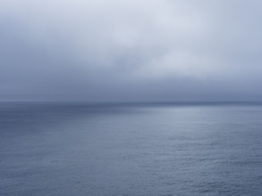 Storm clouds over calm sea
USA