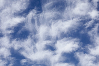 White soft clouds against blue sky
New York City, NY USA