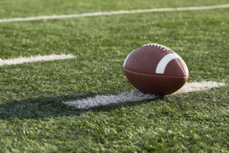 American football ball in field
New York City, NY USA