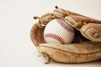 Studio shot of baseball mitt with hard ball
New York City, NY USA