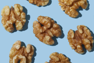 Overhead view of walnuts against blue background
New York City, NY USA