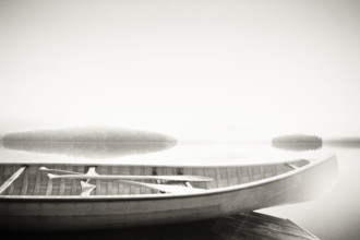 Wood canoe on dock on Lake Placid, black and white
Lake Placid, New York, USA