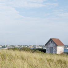 Small stone building and harbor with sailboats
Nantucket, Massachusetts, USA