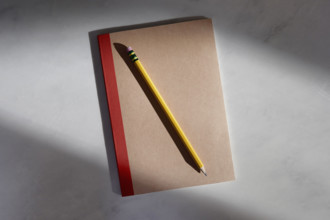 Notebook and pencil on marble surface
New York City, New York State, USA