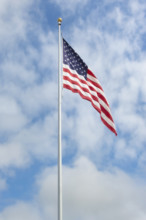 American flag against sky with puffy white clouds
Point Pleasant, New Jersey, USA