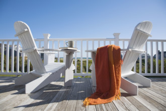 Two adirondack chairs on deck of seaside cottage
Nantucket, Massachusetts, USA