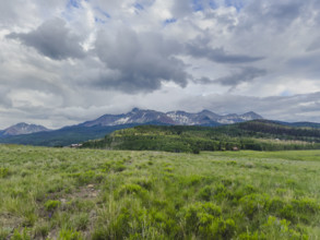 Clouds above grassy meadow and San Juan Mountains
Telluride, Colorado, USA